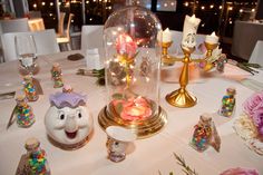 a table topped with lots of candy and candles