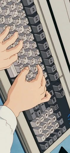 two hands are typing on a computer keyboard