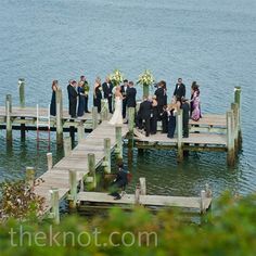 a group of people that are standing on a dock