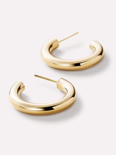 Whether you're dressing up for a night out or adding a touch of elegance to your daily ensemble, these chunky gold hoop earrings are the perfect, solid gold accessory to complement your style. Embrace your inner fashionista and make a bold statement with these striking hoops that exude confidence and charm. It's never been easier to build your solid gold stack! Pair with our Mini Gold Bold C-Hoops. • Bullet point 1The perfect medium sized hoop • Made with 100% recycled, waterproof solid gold • P Chunky Gold Hoop Earrings, Mini Gold, Exude Confidence, Gold Accessories, Letter Necklace, Gold Hoop, Gold Hoop Earrings, Solid Gold, Gold Earrings