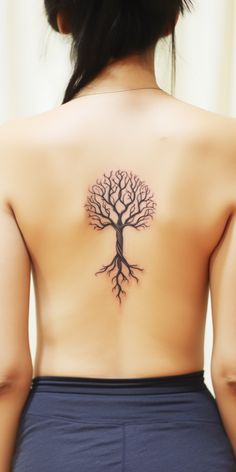 Aesthetic back tattoo showcasing a symmetric Tree of Life with spices, its branches gracefully twisted, embodying nature's tales. Tree Of Life Tattoo Men Chest, Tree Of Life Symbol Tattoo, Bonsai Tree Back Tattoo, Nordic Tree Tattoo, Ornamental Tree Tattoo, Back Tree Tattoo Women, Life Tree Tattoo Design, Tree Back Tattoo Women, Tree Sternum Tattoo