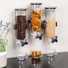 an assortment of food is displayed on a wall mounted spice dispenser,