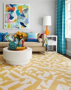 a living room with yellow and blue decor