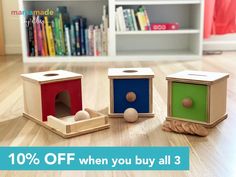 three wooden toys sitting on the floor in front of a bookshelf and bookcase