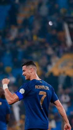 a male soccer player is celebrating his team's victory over the other team in a match