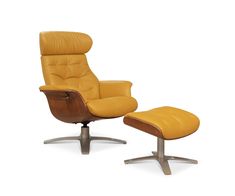 a yellow leather chair and footstool sitting on top of a metal base with an ottoman underneath it