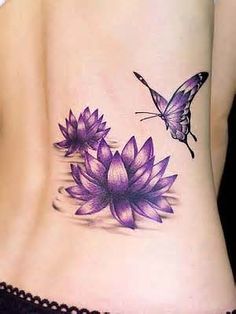 a woman's stomach with flowers on it and a butterfly flying over the top