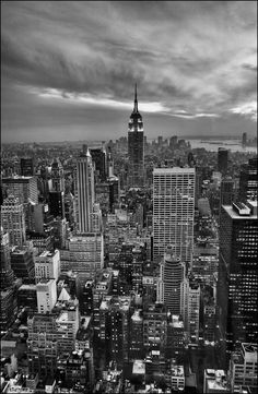 black and white photograph of new york city skyline with empire building in the foreground