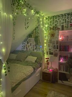 a bedroom decorated in green and white with lots of lights