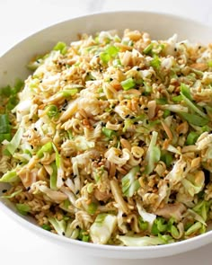 a white bowl filled with rice and vegetables