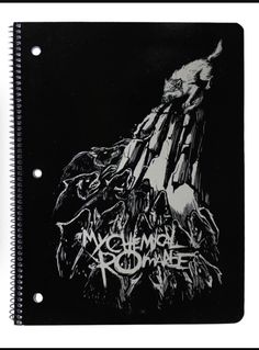 a spiral notebook with an image of a demon on the front and words written in black ink