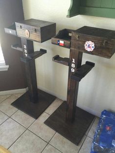 three wooden bird feeders sitting on top of each other