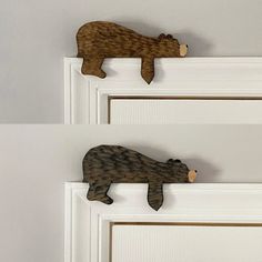 two wooden bear hooks hang on the front door