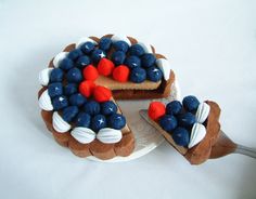 there is a cake with red, white and blue decorations on it