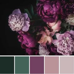 a bouquet of flowers in shades of purple and green