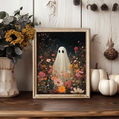 a painting of a ghost surrounded by flowers and pumpkins