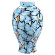 a blue and gold vase with butterflies painted on the front, sitting against a white background