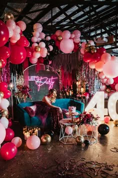 a room filled with lots of balloons and decorations