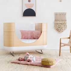 a baby's room with pink and white decor