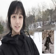 a young woman standing in the snow wearing a black jacket and smiling at the camera