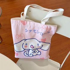 Step into a world of adorable charm with our Kawaii Cartoon Sanrio Character Print Tote Bag, the ultimate accessory for any anime enthusiast or lover of all things cute. This canvas bag features vibrant and delightful Sanrio characters that will bring joy to your everyday errands, making it not just a tote but a statement piece that stands out in any crowd.