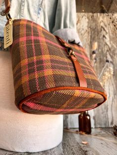 This seamless and intricate tartan plaid is woven into the fabric and is just perfect for those crisp walks in the autumn air.

The Atenti Scottie Halle Bucket Bag features two interior pockets, leather detachable adjustable crossbody strap, and a leather closure. Halle measures: 8″ wide x 8″ high x 5.5″ deep. Fall Season Leather Handled Crossbody Bucket Bag, Fall Travel Bucket Bag With Detachable Strap, Fall Leather Trim Satchel Shoulder Bag, Fall Satchel Shoulder Bag With Leather Trim, Fall Travel Bucket Bag With Adjustable Strap, Fall Leather Trim Crossbody Shoulder Bag, Plaid Bags For Everyday Use In Fall, Fall Bags With Leather Trim, Fall Travel Shoulder Bag With Leather Trim