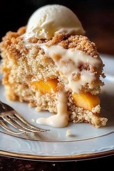 a piece of cake with ice cream on top is sitting on a plate next to a fork