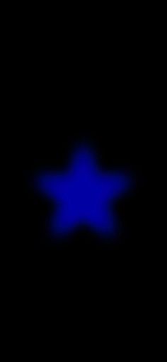 an image of a blue star in the dark