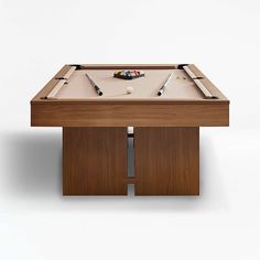 a pool table with two cues and a ball on the top, in front of a white background