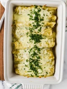 a casserole dish with spinach and cheese