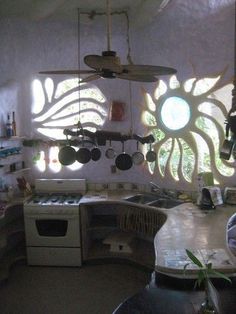 a kitchen with an oven, stove and sink