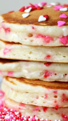 stack of pancakes with pink and white sprinkles