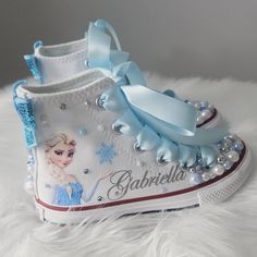 Genuine Converse brand white high tops. Bling toes, sides, and backs. Blue satin ribbon laces. Converse With Pearls, Bling Toes, Ribbon Laces, White High Tops, Queen Elsa, Sneakers Athletic, Girls Sneakers, Blue Satin, Satin Ribbon