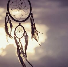 an image of a dream catcher in the sky