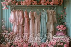 there are many dresses on display in the room with pink flowers and roses around them