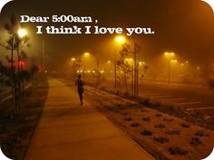 a person running down a sidewalk at night with the words dear 500am, i think i love you