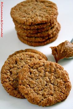 three cookies are stacked on top of each other and one has a bite taken out of it