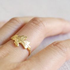 This little oak leaf ring makes a subtle statement on its own.  Pictured are the silver oak leaf ring and gold oak leaf ring layered together for a two tone statement - or pair it with one of our Swarovski crystal gemstone rings (shown in silver and Topaz).  Tumble polished for hours to achieve a satin finish.MATERIALStarnish resistant rhodium silver filled/14k gold filledDIMENSIONSleaf focal measures 23x11mm (7/8" x 7/16").◊ More oak leaf jewelry: https://www.etsy.com/shop/kindlingandco?search_ Nature-inspired Leaf Jewelry For Everyday, Everyday Nature-inspired Leaf Jewelry, Oak Leaf Jewelry, Leaf Earrings Stud, Oak Leaf Necklace, Silver Oak, Jewelry Nature, Brown Jewelry, Custom Ring Designs