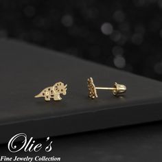 These playful Triceratops dinosaur stud earrings is the perfect addition to your children's jewelry collection. Perfect gift idea for children, daughter, granddaughter, niece, sister and friends. *Product Details* Material: 14K Gold Metal Color: Yellow Gold Earring Size: Length (5mm), Width (9.25mm) Metal Finish: Polished Post Length: 8mm long for Screw Back and 9mm for Push Back Sold in Pair (2 earrings) Occasion: Everyday use, Birthday Present, Thank You Gift, Valentine's Day, Mother's Day, Fr Dino Kids, Children's Jewelry, Dinosaur Earrings, 2 Earrings, Kids Earrings, Animal Earrings, Childrens Jewelry, Cute Dinosaur, Gold Earring