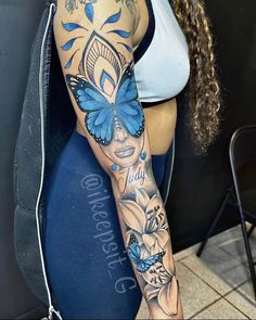 a woman with a butterfly tattoo on her arm