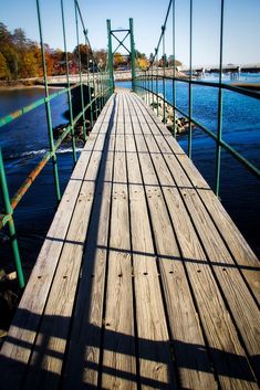 a long wooden bridge over a body of water