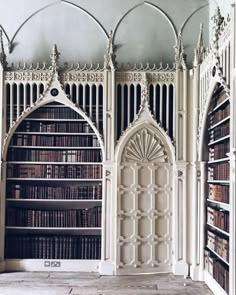 an old library with many bookshelves and arched doorways in the middle,