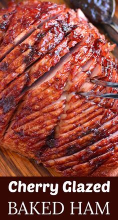 a large piece of glazed ham on a cutting board with a knife and fork in it