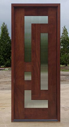 a wooden door sitting on top of a cement ground