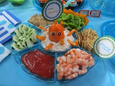 a blue table topped with lots of food