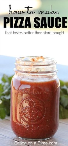 a jar filled with pizza sauce sitting on top of a wooden table