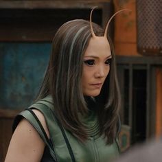 a woman with horns on her head in a scene from the movie x - men days of future past