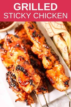 grilled chicken skewers with bbq sauce on the side and text overlay