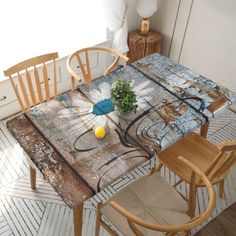 a table with chairs and a painting on it