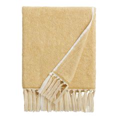 a yellow towel with fringes on it